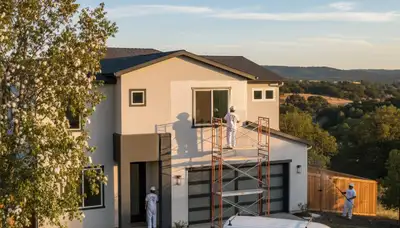 Professional house painting contractors working on residential exterior in Redding, CA